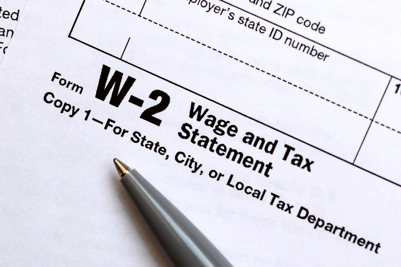 a pen lies on a W-2 form