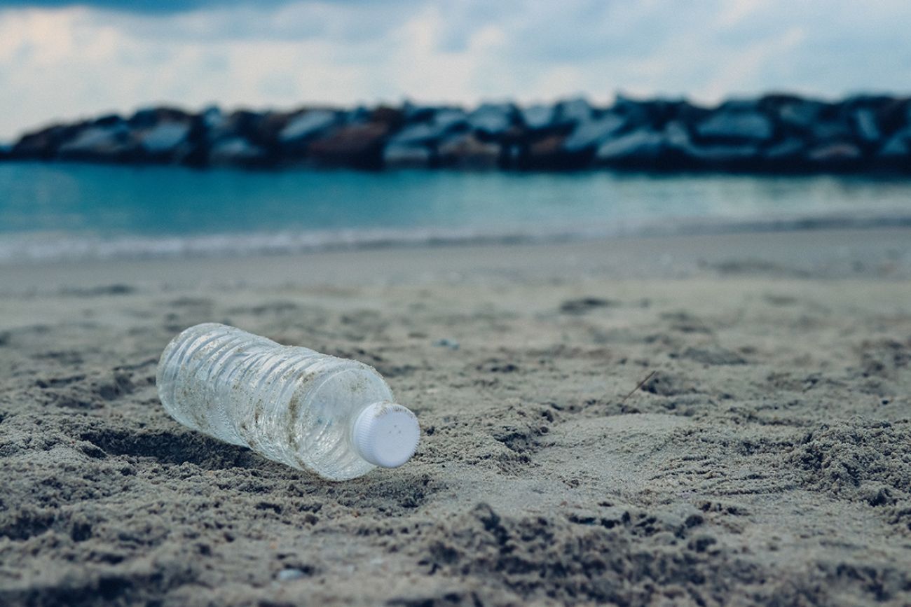 Bottle plastic on stone ground show long life garbage concept