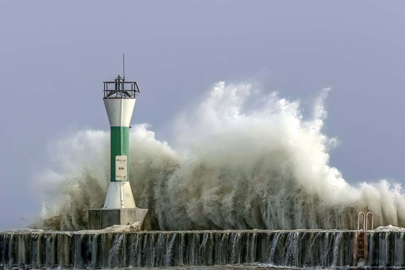 Large waves crash into the navigation and pier on the shores of Lake Michigan