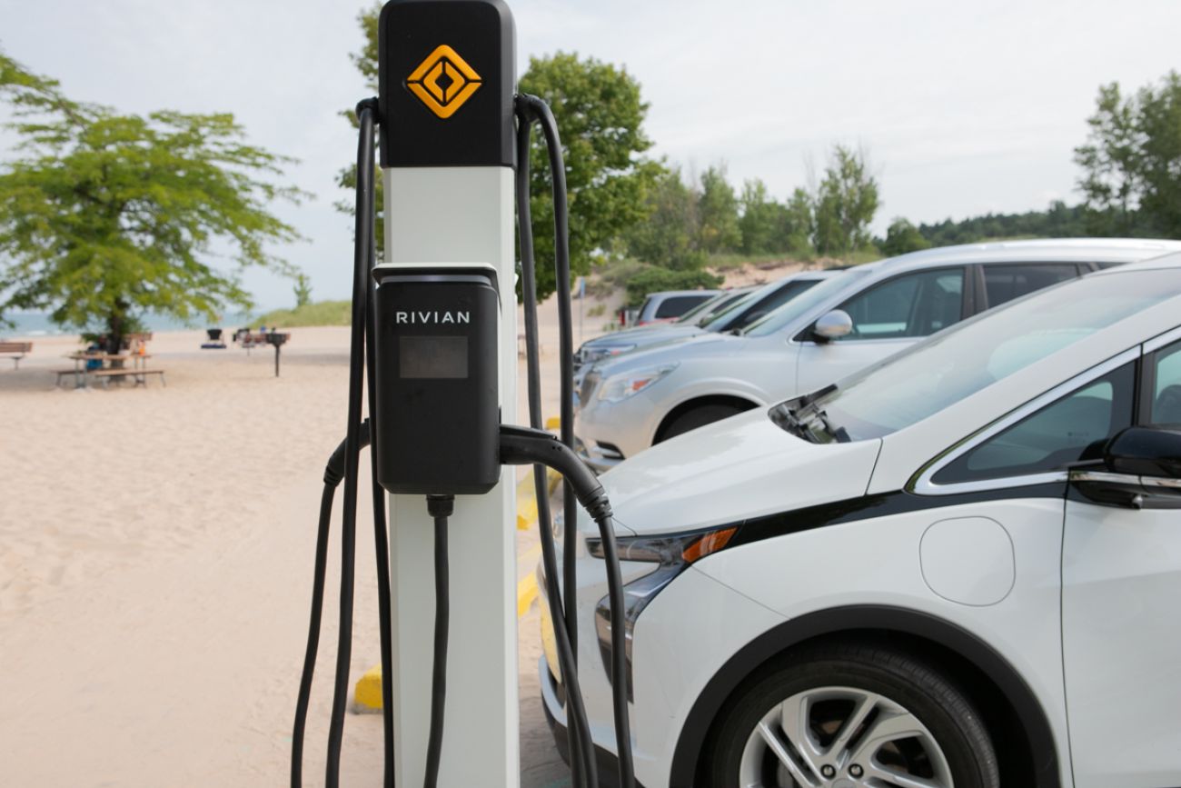 EV cars being charged on the beach