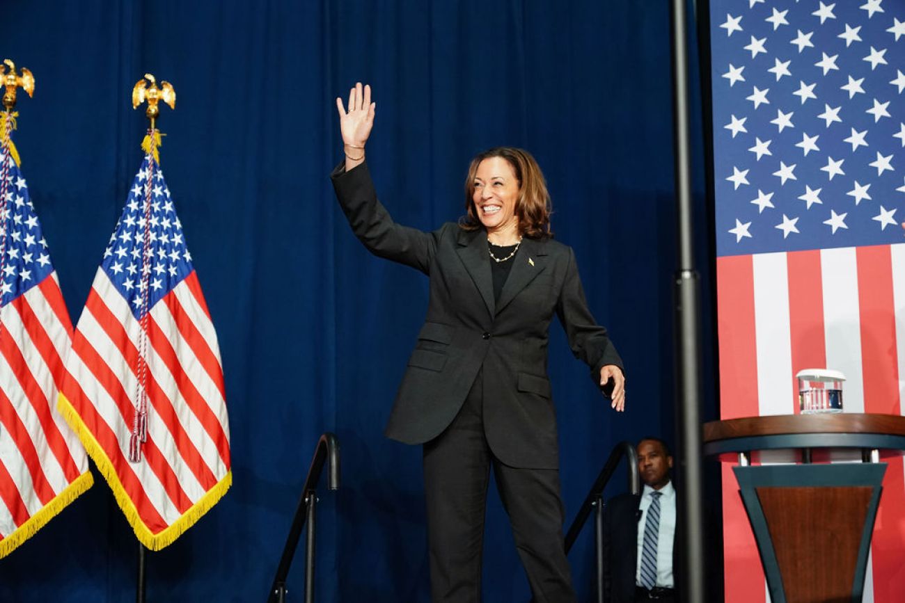 Vice President Kamala Harris waving to supporters from the stage