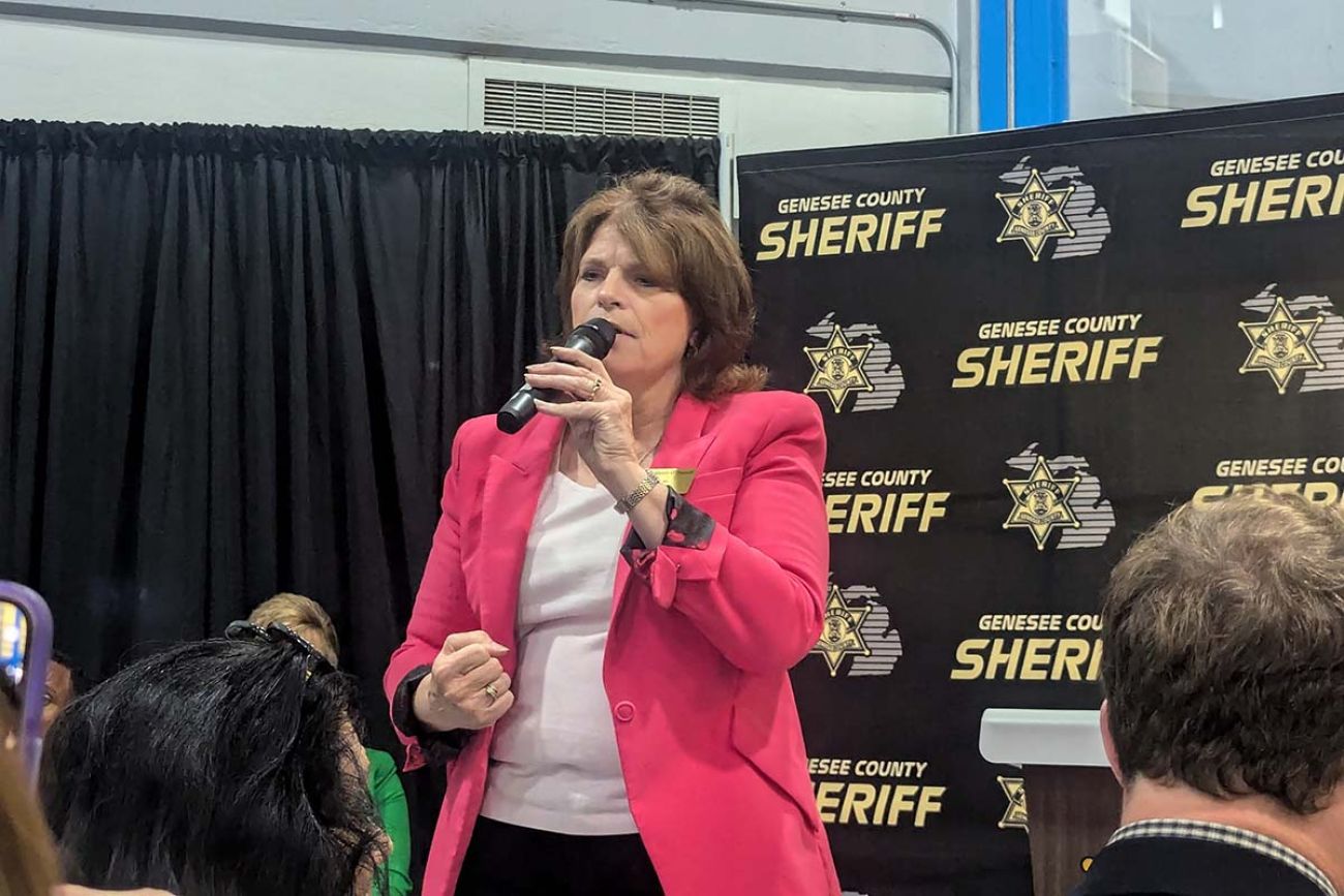 Sherry O’Donnell speaking into a microphone