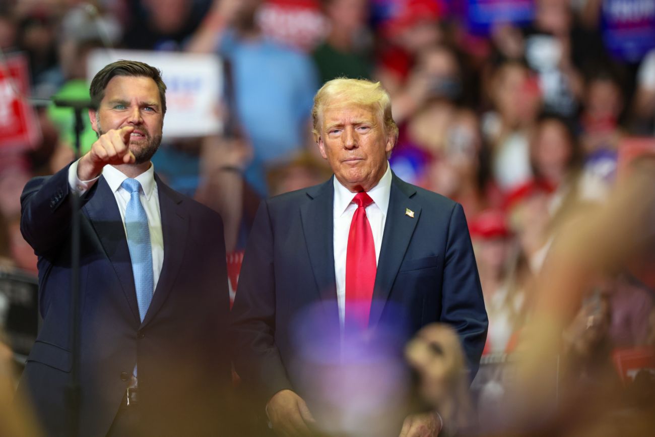 JD Vance stands to the left of Donald Trump