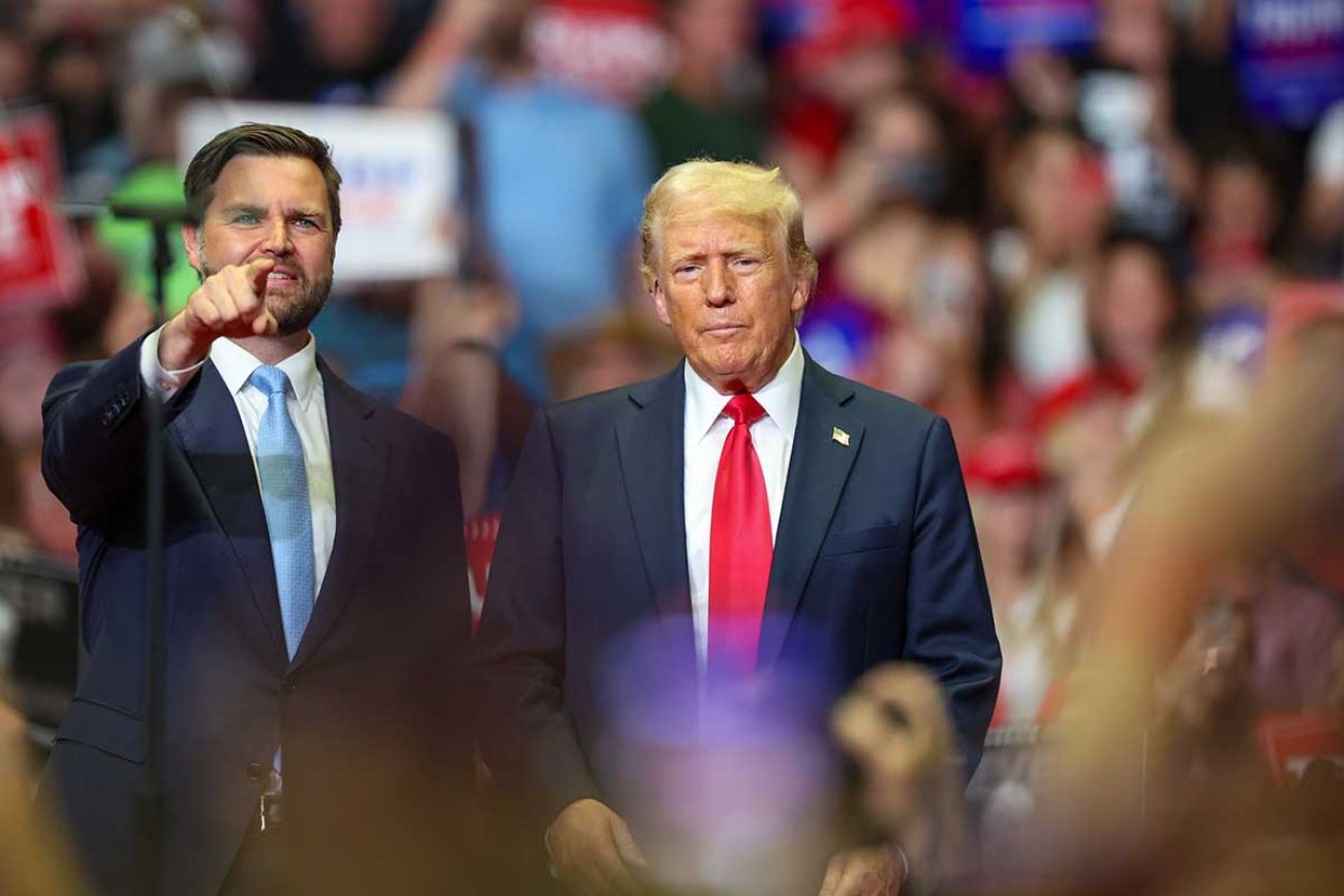 JD Vance stands next to Donald Trump at a rally