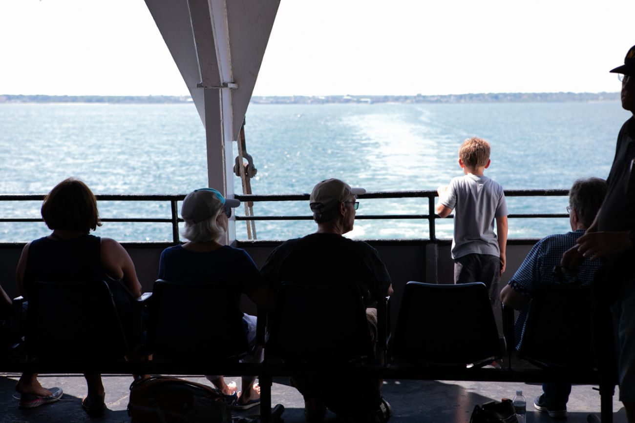 People looking out on Lake Michigan on the SS Badger