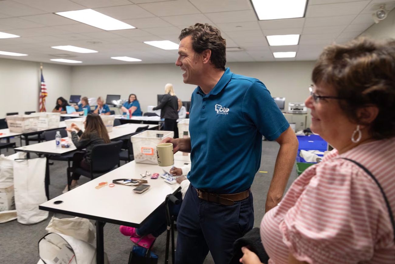 Canton Township Clerk Michael Siegrist talking to election workers