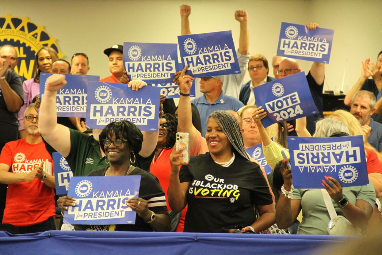 Supporters holding signs supporting Kamala Harris