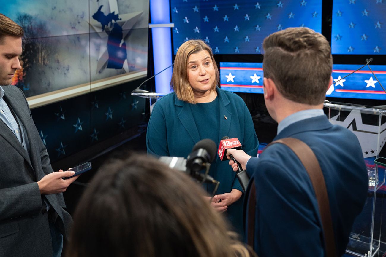 Elissa Slotkin speaks to reporters by her