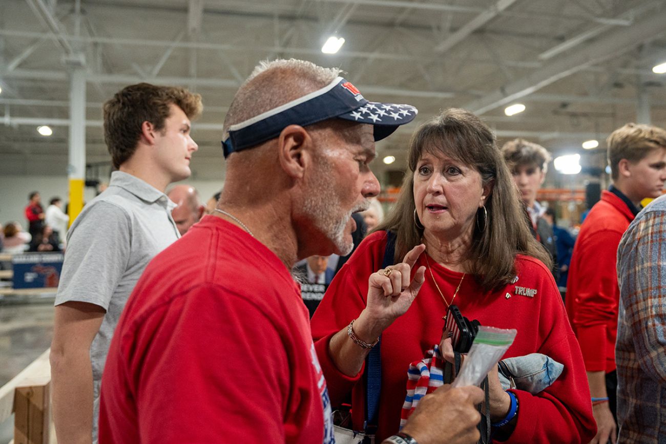 Brian Pannebecker wearing a red t-shirt. Near other people