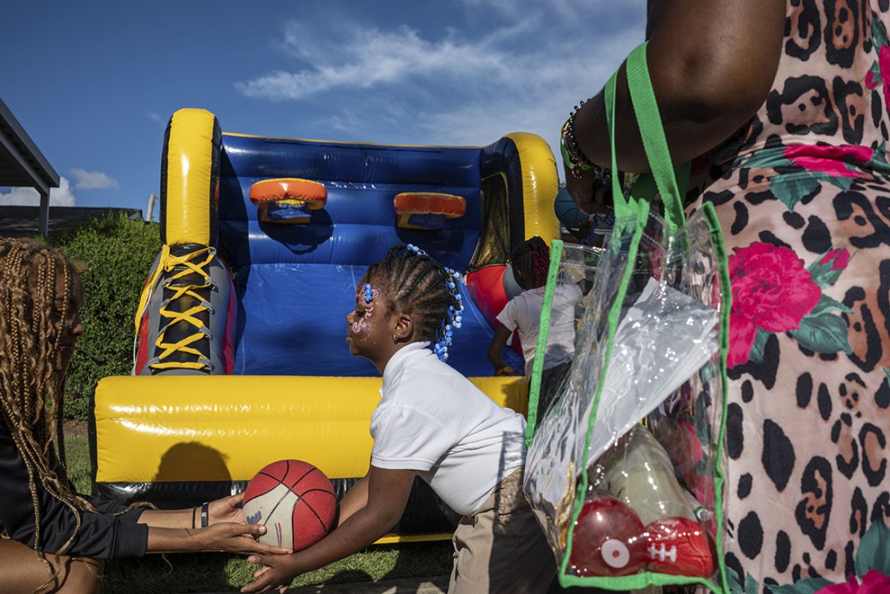 People waiting for a basketball bouncehouse