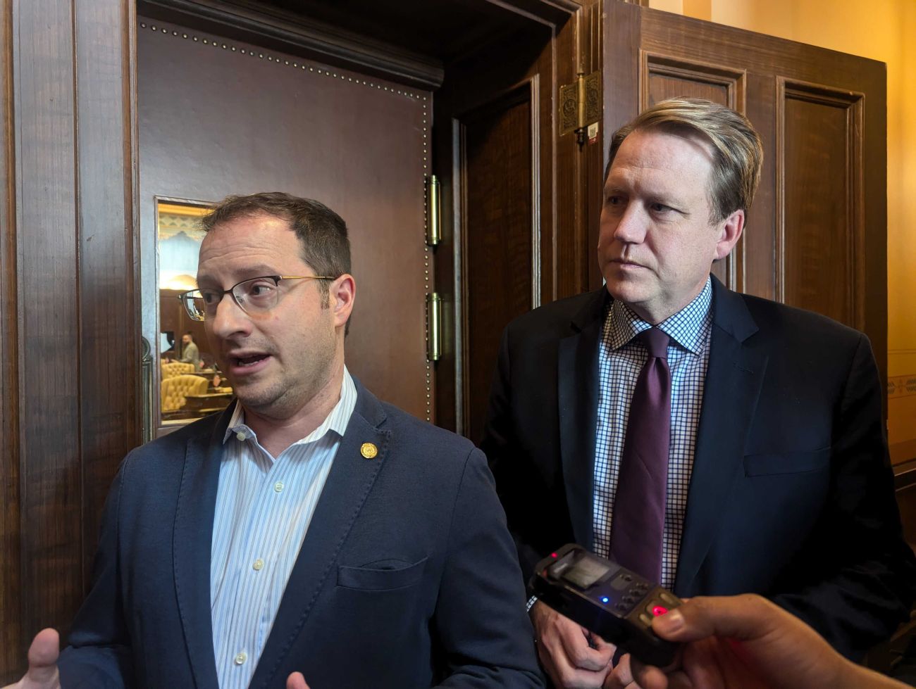 Senate Minority Leader Aric Nesbitt standing next to man