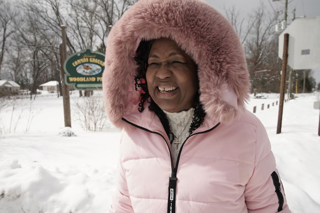 Denise Suttles wearing a pink coat. 