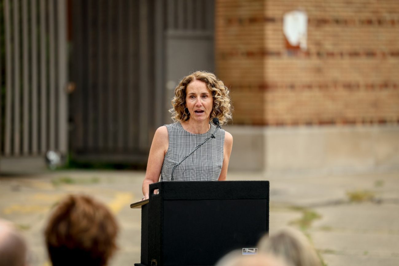 Woman speaks at podium