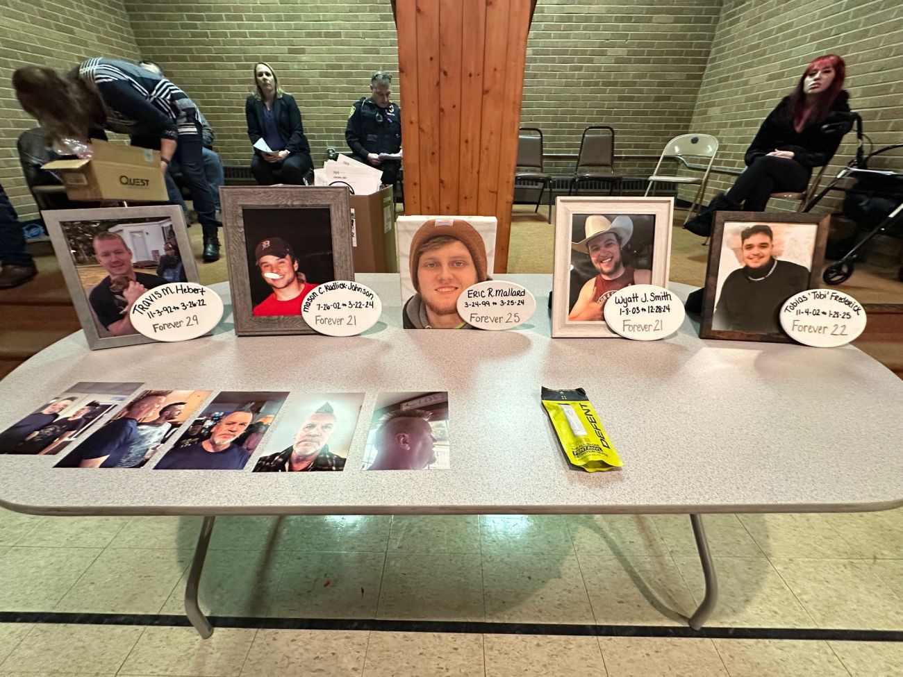 The four who died photos on a table.