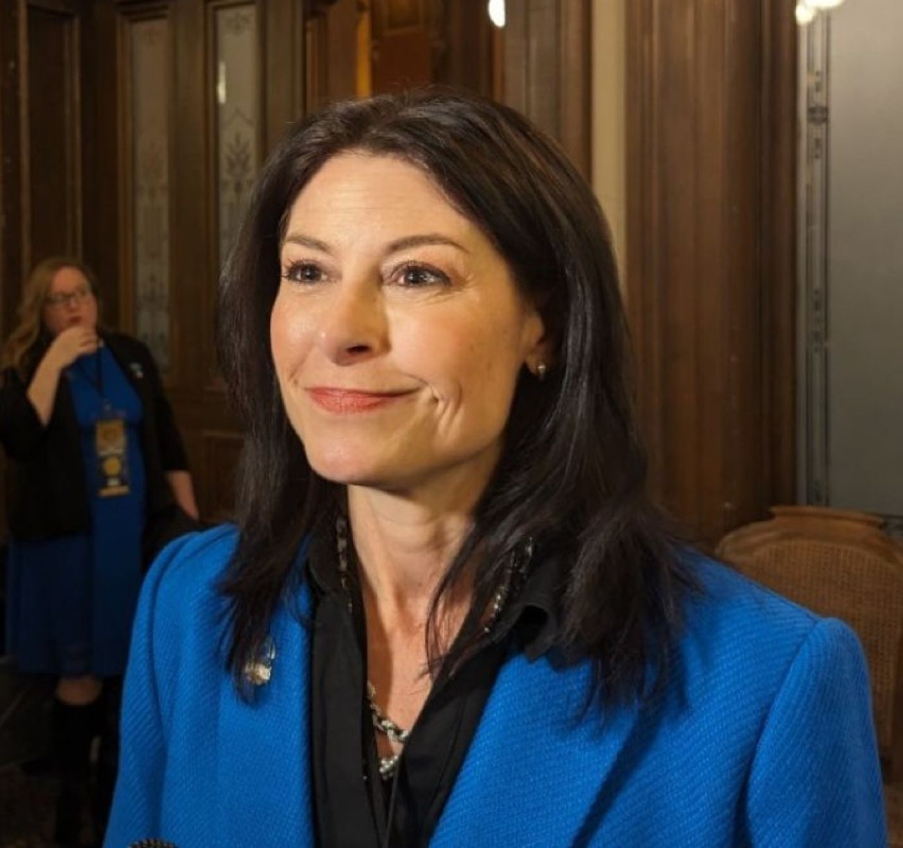 Michigan Attorney General Dana Nessel smiles
