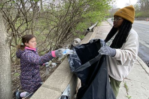 Volunteers picking up trash from the Rogue River