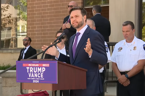 Vice President JD Vance speaking into a microphone in Michigan.