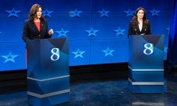 Gov. Gretchen Whitmer and Republican challenger Tudor Dixon on a debate stage