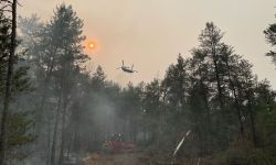 Aircraft flying over forrest fire in Michigan