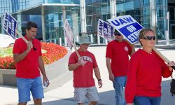 UAW Strikers with signs in front of General Motors Headquarter in 2019