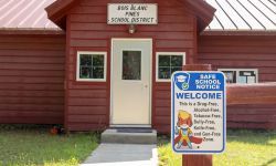 Bois Blanc Pines School, a small red building