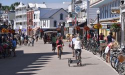 A lot of people on the main street of Mackinac Island. You can see people riding bikes