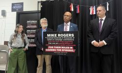 People are stand up behind a podium for a press conference 