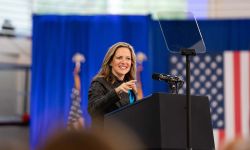 Michigan Secretary of State Jocelyn Benson at a rally. She is standing behind a podium