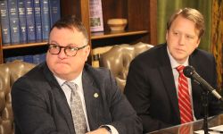 House Minority Leader Matt Hall sitting at a table