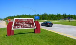 Highway sign welcomes tourist to Michigan's Upper Peninsula