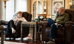 Dr. Arnold Beresh and Michele Beresh sitting in chairs in the living room