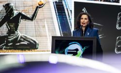 Michigan Gov. Gretchen Whitmer speaks at a podium at the Detroit Auto Show