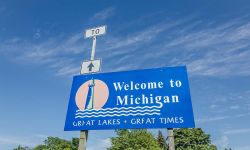 A blue Welcome to Michigan sign