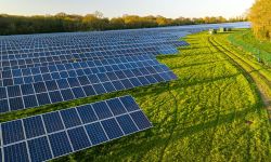 Solar farm; a row of solar panels outside