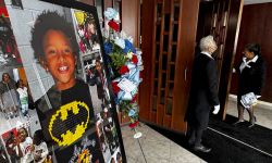 Pictures on display at the funeral for Darnell Currie Jr. and his sister A’millah Currie. In one photo, he is wearing a batman shirt.