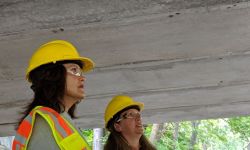 Gov. Gretchen Whitmer with a yellow hard hat. 