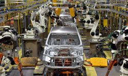 A car being produced in an assembly plant.