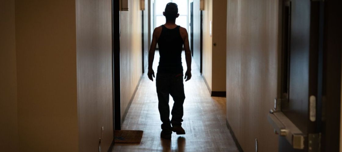 Man stands in hallway
