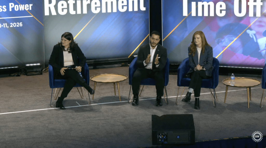 All three Democratic on a stage at a forum,