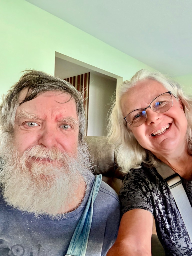 Selfie of a man on the left and woman on the right.